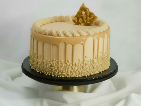 Chocolate peanut butter cake. A heavenly combination of fluffy chocolate sponge layered with smooth peanut butter cream and a generous peanut butter filling. This indulgent two-layer cake is beautifully decorated with crunchy peanut brittle pieces and a caramel drip for extra. Whether you're a devoted peanut butter fan or simply love chocolate with a nutty twist, enjoy convenient delivery across London with flexible same-day and next-day options to suit last minute ordering. Perfect as a surprise gift