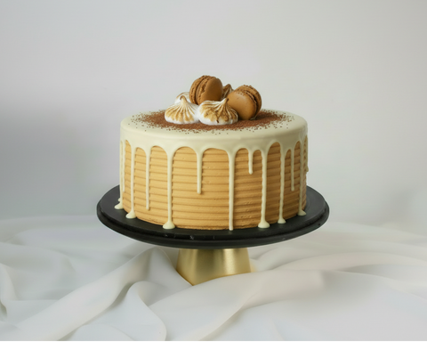 This classic caramel cake is an exquisite treat, and is also a good celebration cake for milestones such as birthdays and an anniversary cake. Pictured is an 8 inch cake that feeds 12-14 people. Available for cake delivery in London